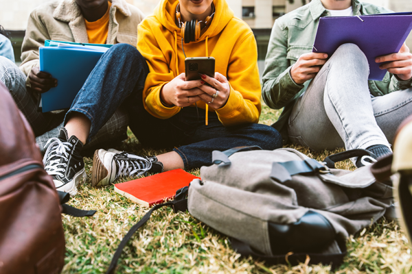 Students gathered to study outside on the grass