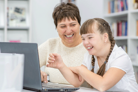 Students and teacher laughing together